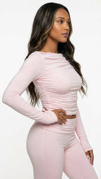 woman wearing a pink long sleeve top blush